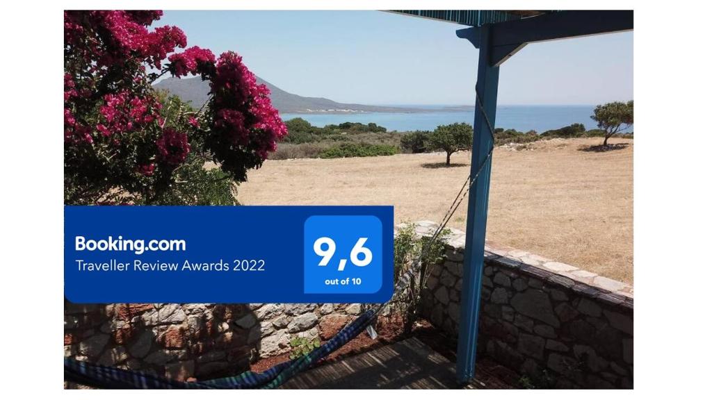 a sign for a house with a view of the ocean at Kasi's nature home in Kýthira