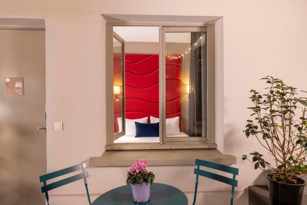 Coin salon dans l'établissement Hôtel L'Interlude