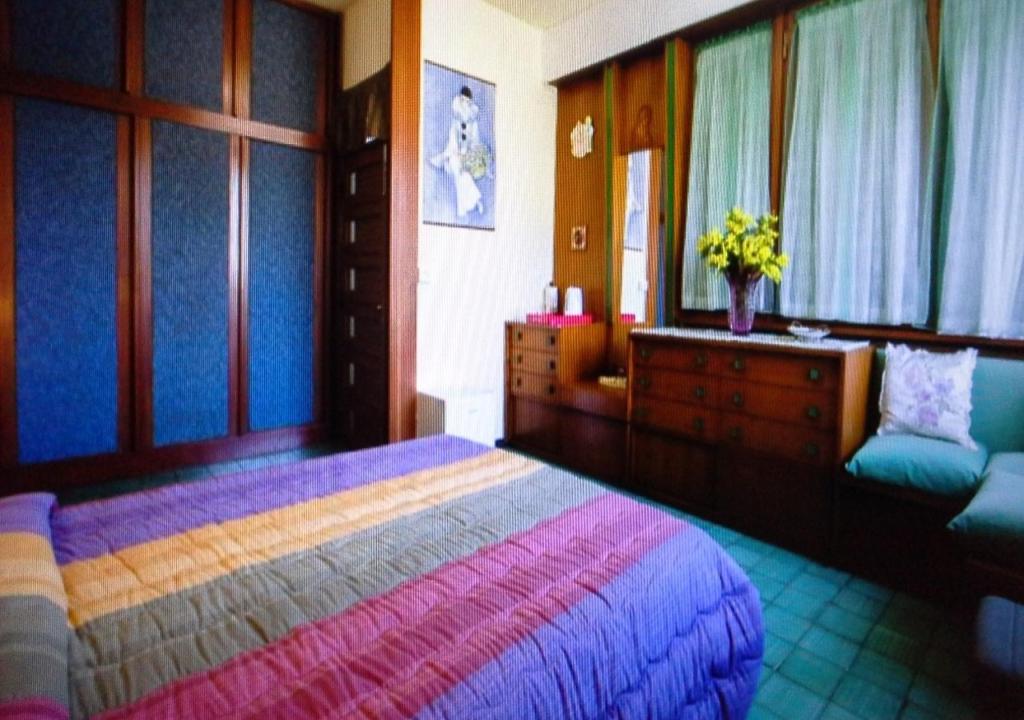Łóżko lub łóżka w pokoju w obiekcie VILLA MIMOSA Splendida Vista Mare