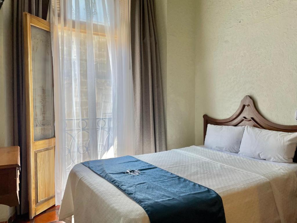 Postel nebo postele na pokoji v ubytování Hotel Frances