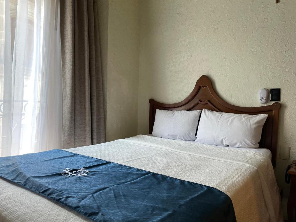 Postel nebo postele na pokoji v ubytování Hotel Frances
