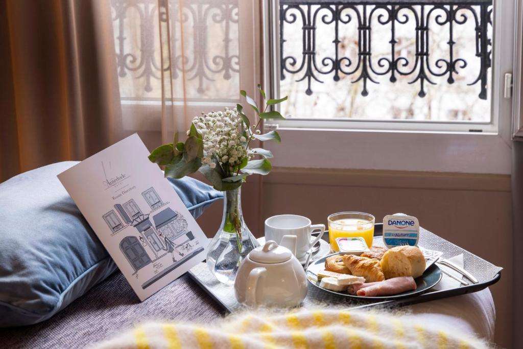 Un ou plusieurs lits dans un hébergement de l'établissement Hôtel L'Interlude