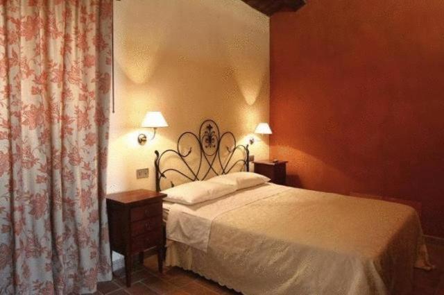Postel nebo postele na pokoji v ubytování Residence Borgo Da Mare