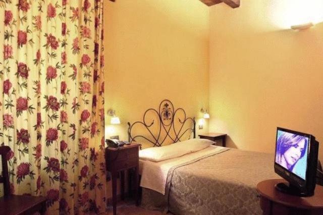 Postel nebo postele na pokoji v ubytování Residence Borgo Da Mare