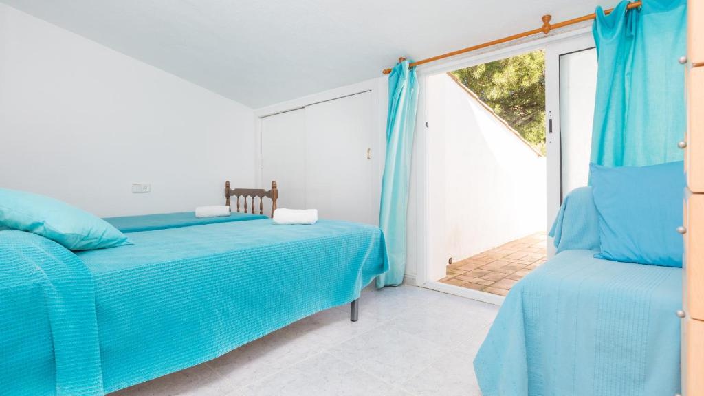 Postel nebo postele na pokoji v ubytování Atic Mar - Calella de Palafrugell