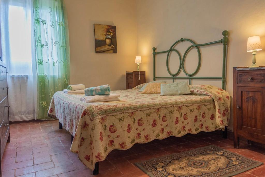 Postel nebo postele na pokoji v ubytování Agriturismo La Ripolina