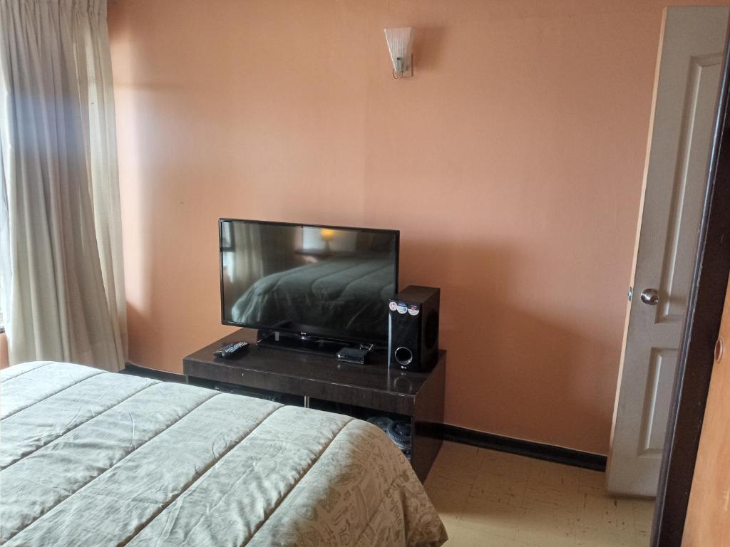 Postel nebo postele na pokoji v ubytování Tu Jardín Secreto