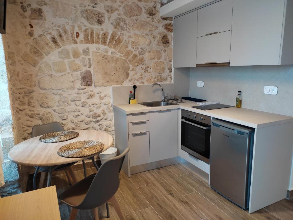 Kuchyňa alebo kuchynka v ubytovaní Loggia Traditional Suites