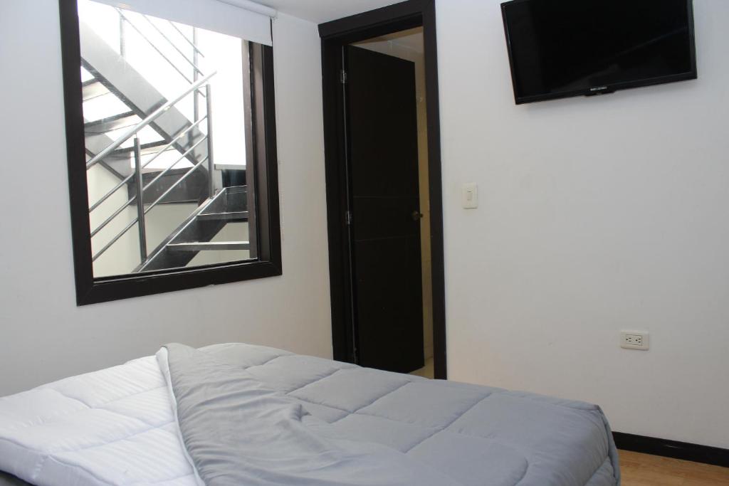 Postel nebo postele na pokoji v ubytování Hotel Montecarlo Boutique
