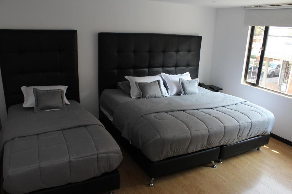 Postel nebo postele na pokoji v ubytování Hotel Montecarlo Boutique