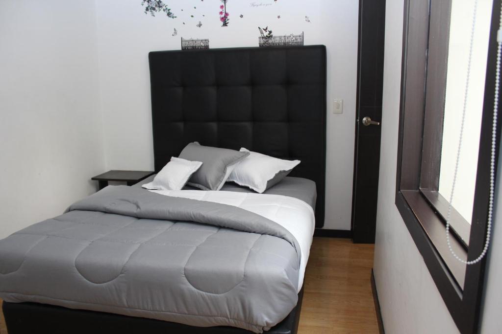 Postel nebo postele na pokoji v ubytování Hotel Montecarlo Boutique