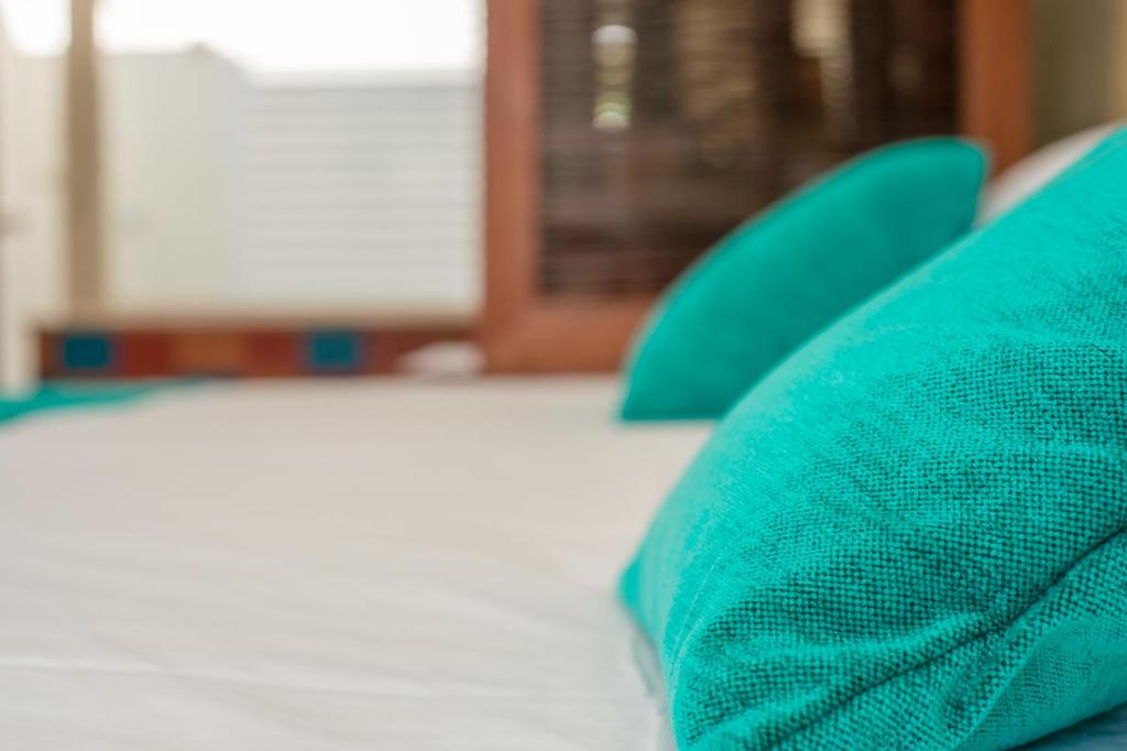 Postel nebo postele na pokoji v ubytování Suites Anagani