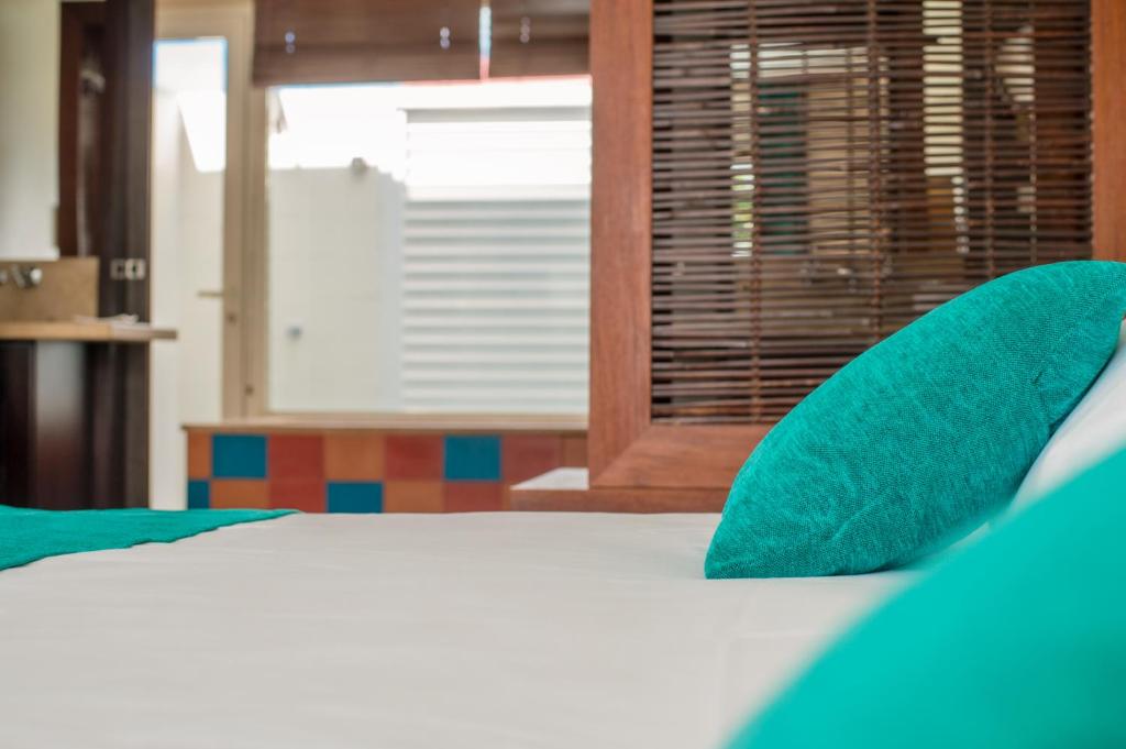 Postel nebo postele na pokoji v ubytování Suites Anagani
