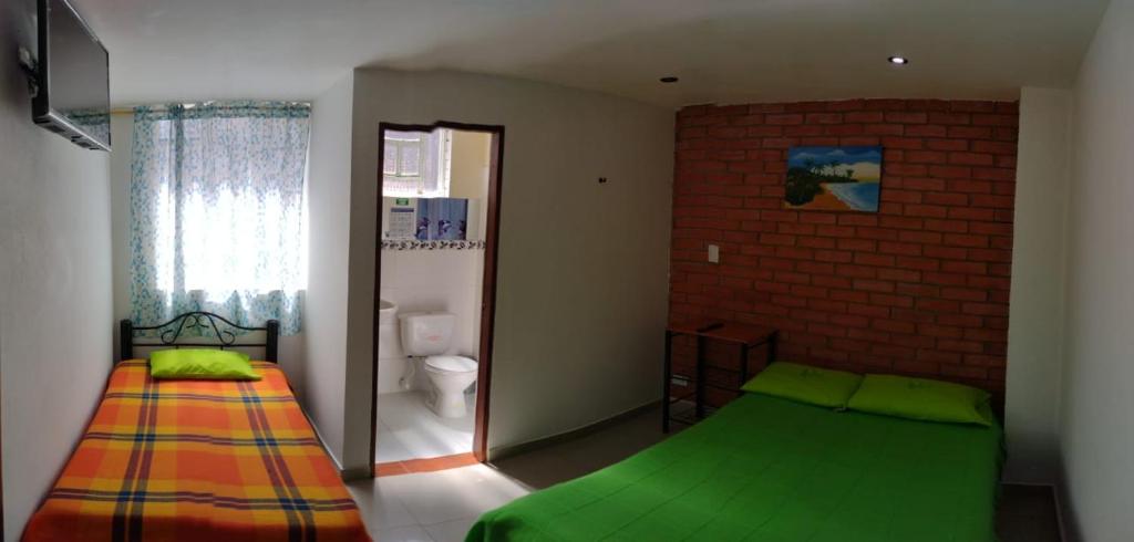 Postel nebo postele na pokoji v ubytování Córest Hotel B&B