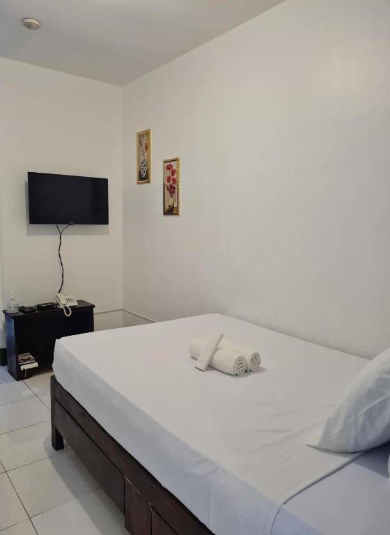 Postel nebo postele na pokoji v ubytování AMARANTA SUITES