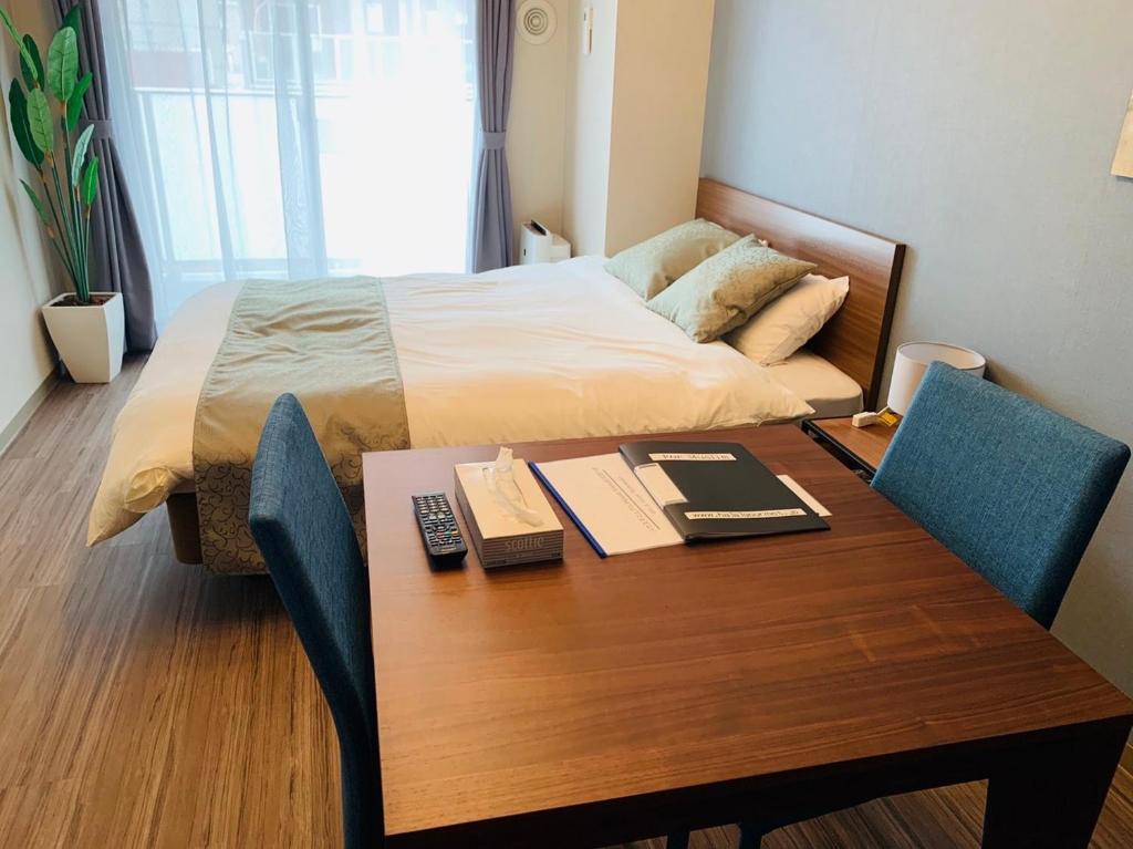 Cama ou camas em um quarto em @RLiS_house Tsutenkaku - Vacation STAY 7961