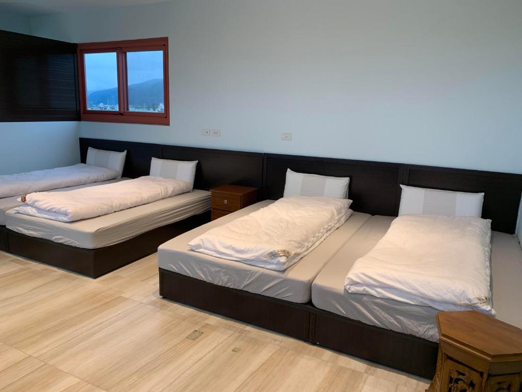 Postel nebo postele na pokoji v ubytování First Shanhai Hotel