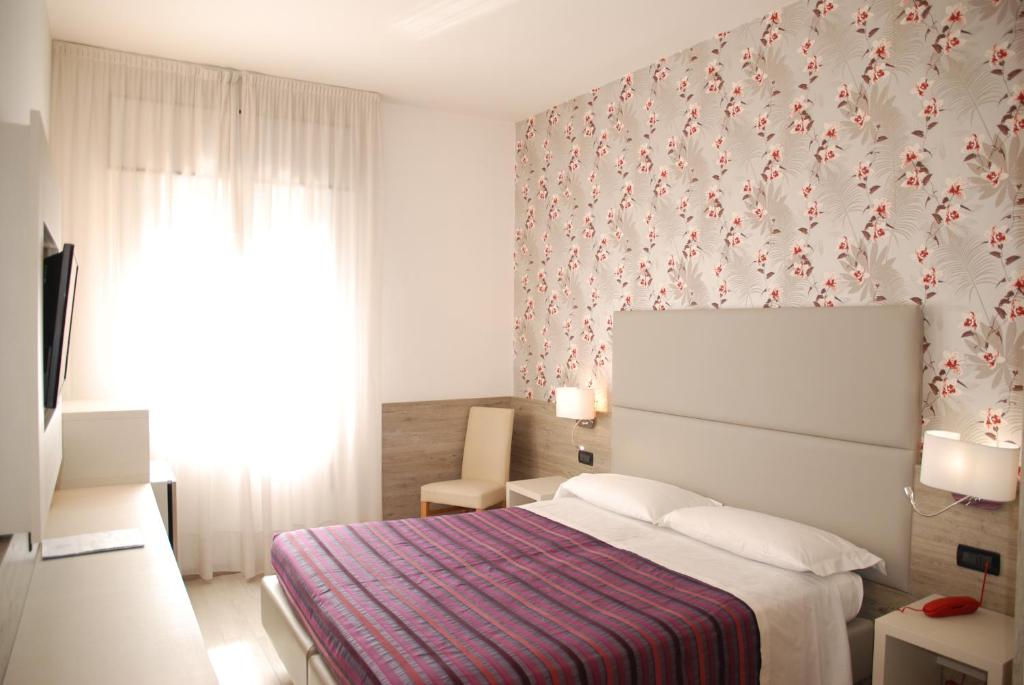 Posteľ alebo postele v izbe v ubytovaní Hotel Lugano Torretta