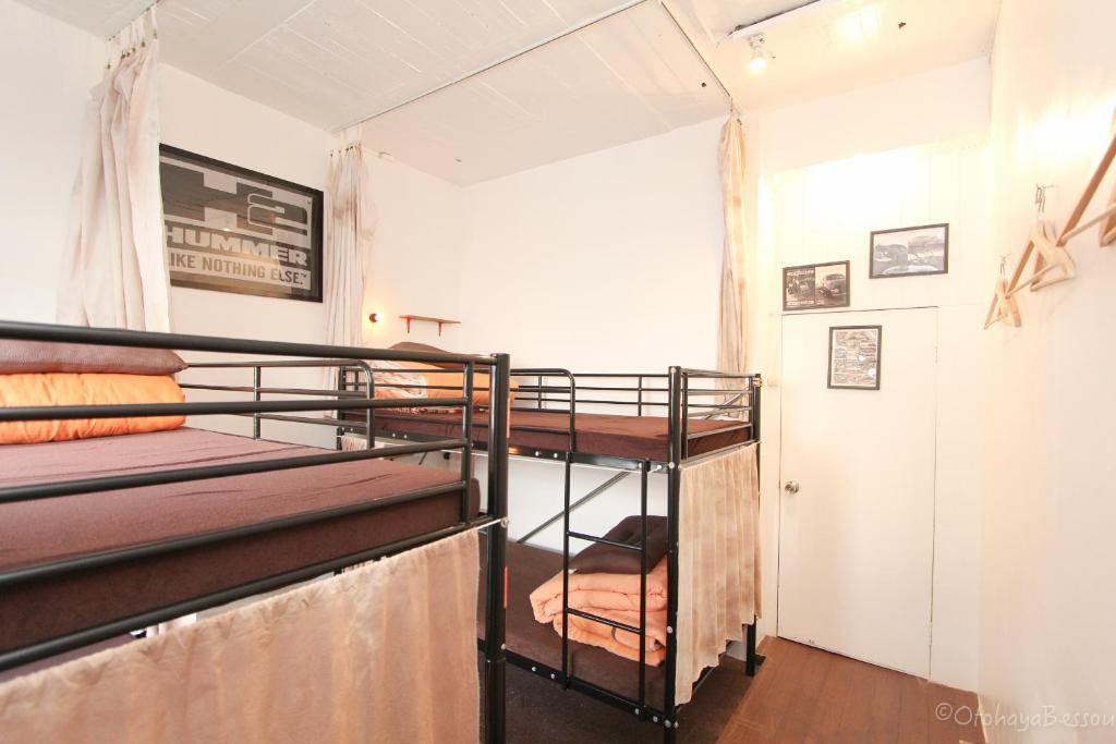 Postel nebo postele na pokoji v ubytování Otohaya Guesthouse