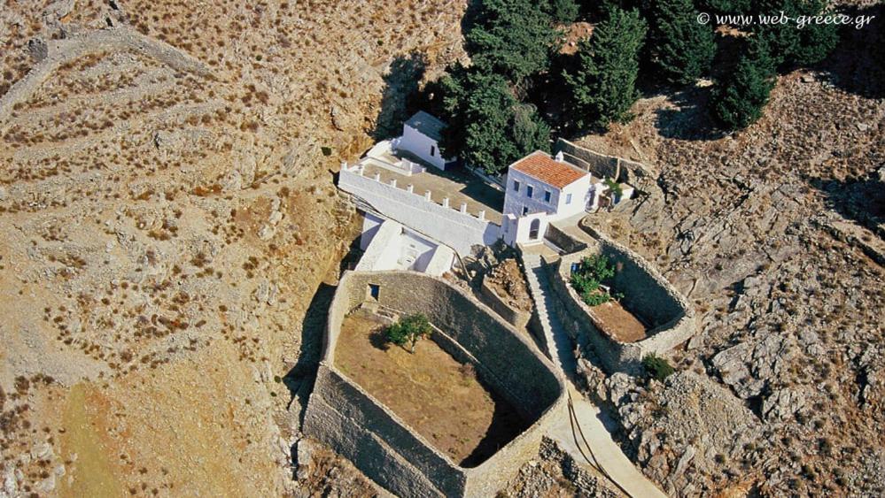 an aerial view of a building on a mountain at Symi . VILLA CALME (Sur la Mer). in Symi