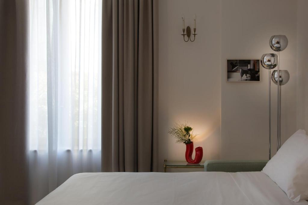 Łóżko lub łóżka w pokoju w obiekcie Corso Novara 5 Design Apartments