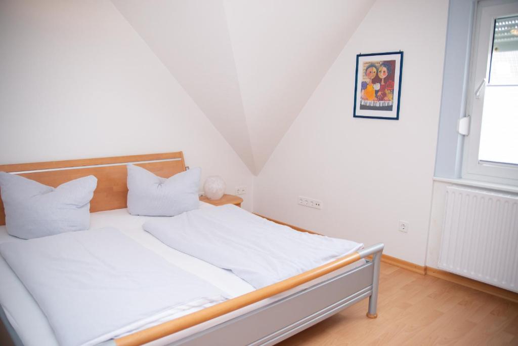 Postel nebo postele na pokoji v ubytování Ferienhaus Rike