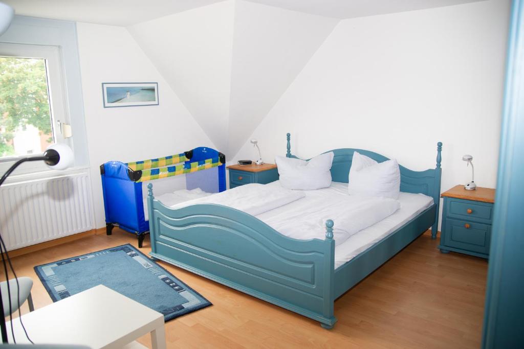 Postel nebo postele na pokoji v ubytování Ferienhaus Rike
