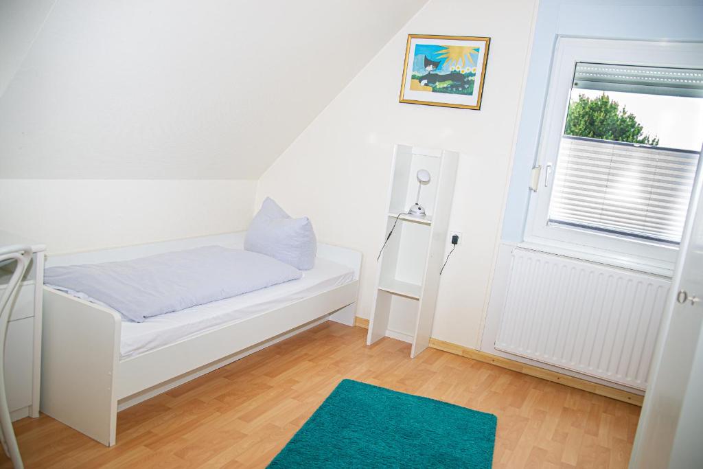 Postel nebo postele na pokoji v ubytování Ferienhaus Rike