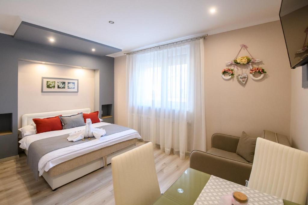 Postel nebo postele na pokoji v ubytování Jázmin Apartmanház
