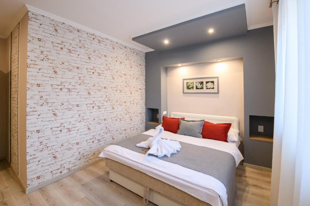Postel nebo postele na pokoji v ubytování Jázmin Apartmanház