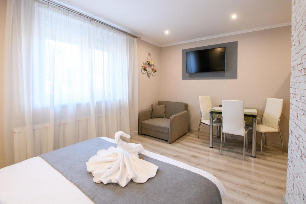 Postel nebo postele na pokoji v ubytování Jázmin Apartmanház