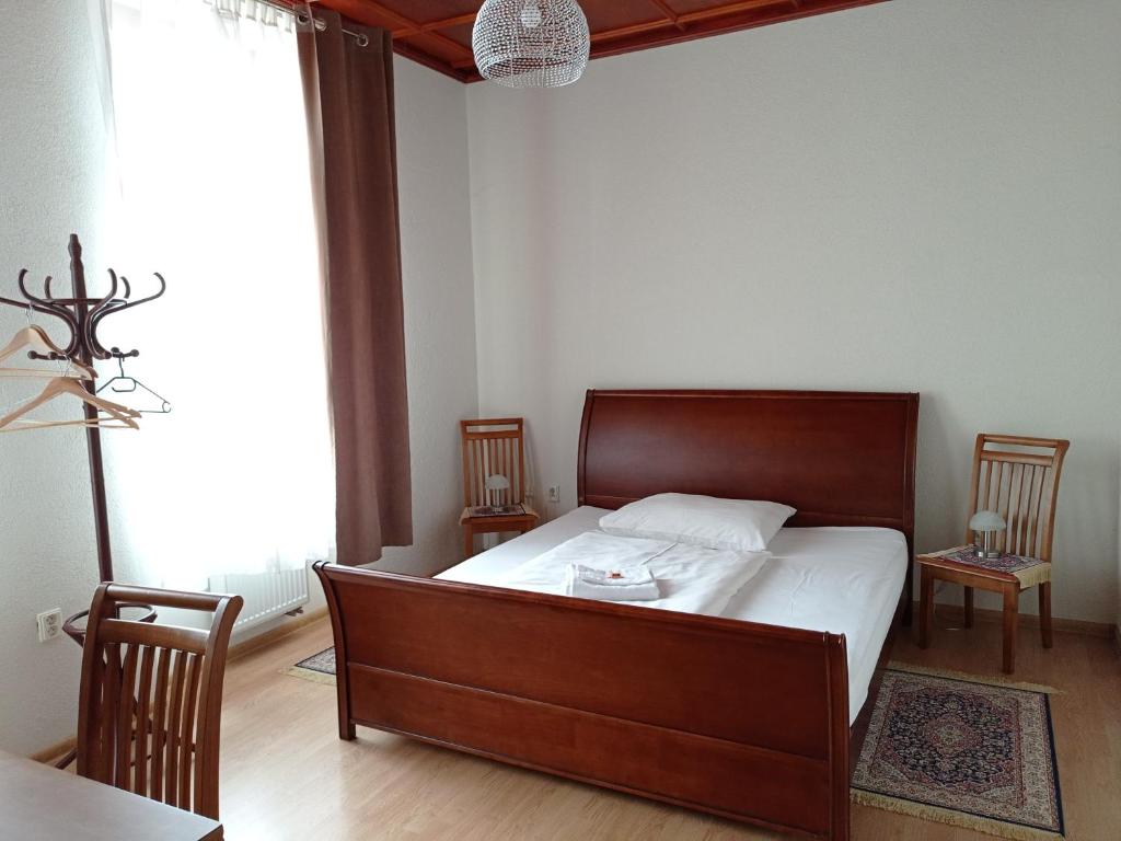 Postel nebo postele na pokoji v ubytování Hotel na Kafkové
