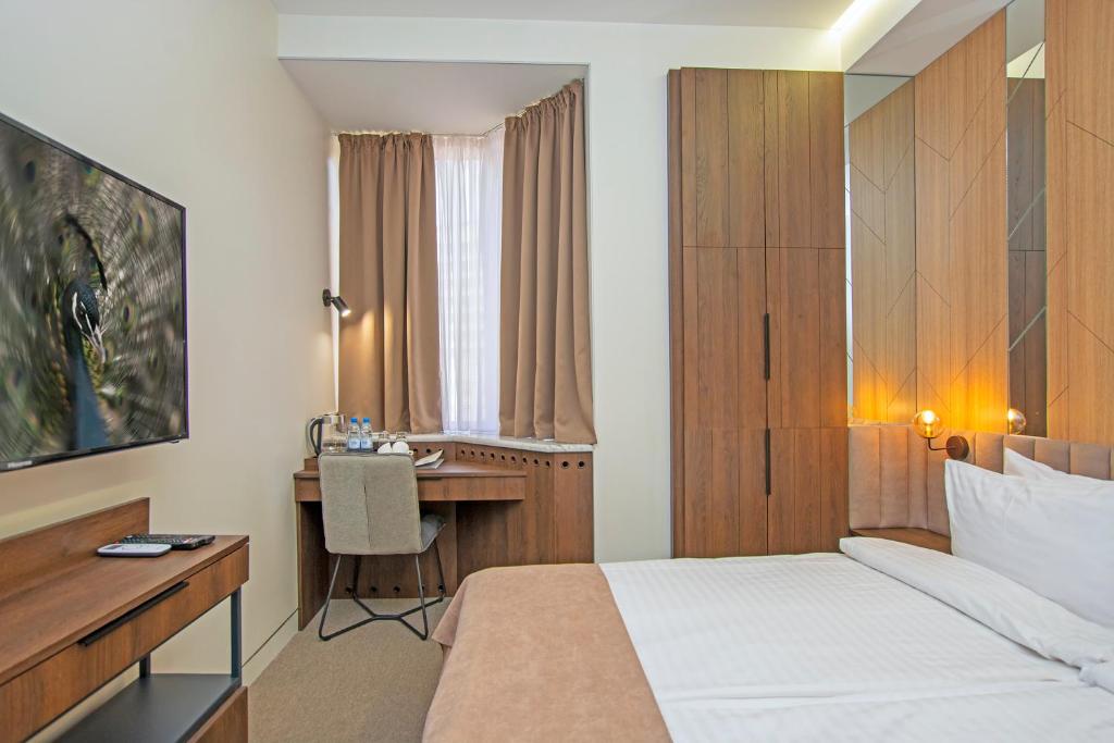 Postel nebo postele na pokoji v ubytování Cartez Hotel
