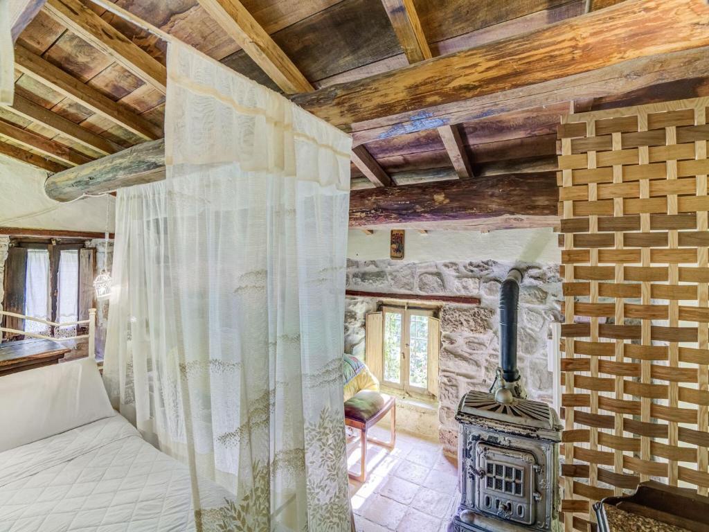 A bed or beds in a room at Belvilla by OYO Mulino