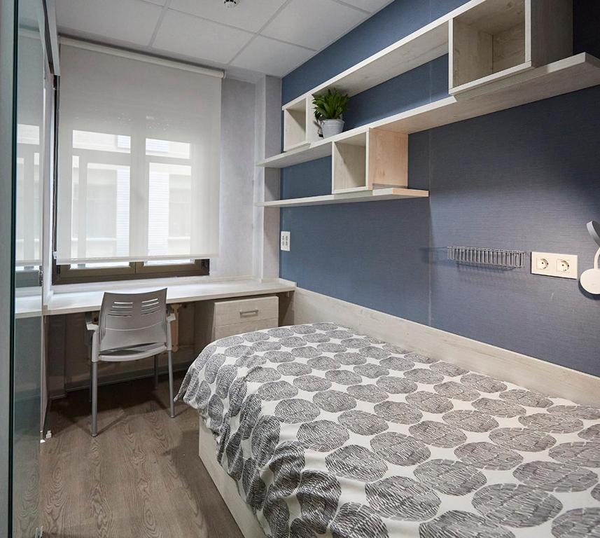Postel nebo postele na pokoji v ubytování Albergue Residencia Larraona