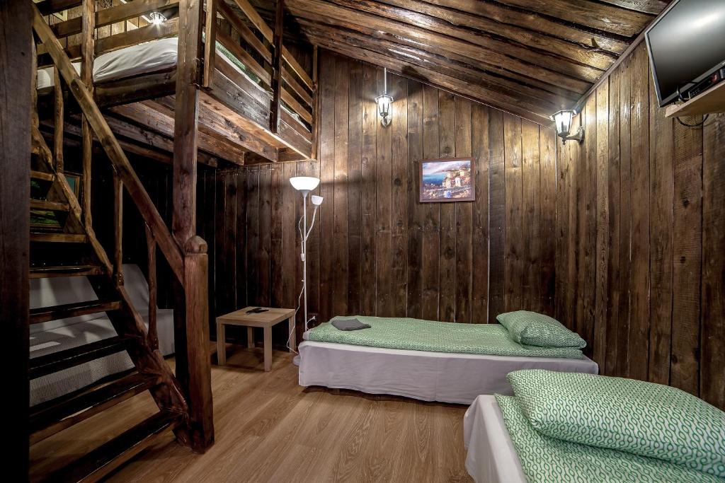 Кровать или кровати в номере Апарт-коттедж Sheriff-mini с зоной для барбекю в экологичной части Выборга