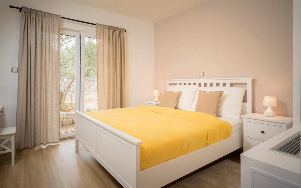 Posteľ alebo postele v izbe v ubytovaní Hvaretta Villas