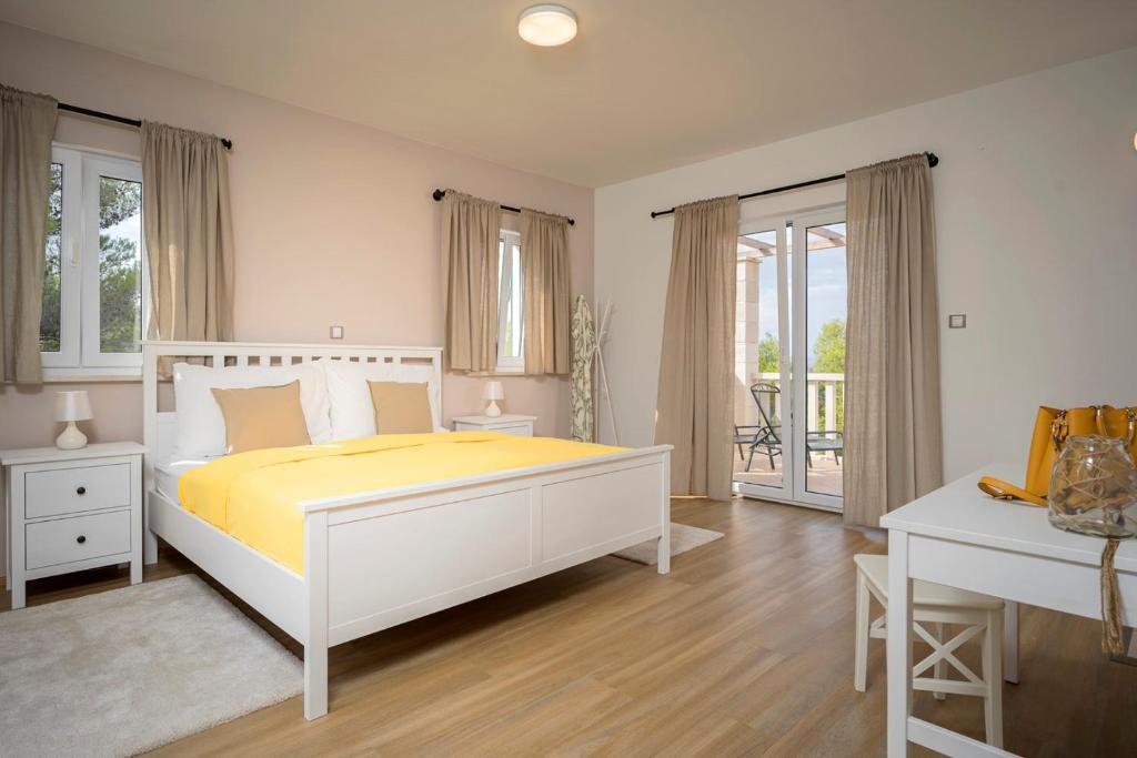 Posteľ alebo postele v izbe v ubytovaní Hvaretta Villas