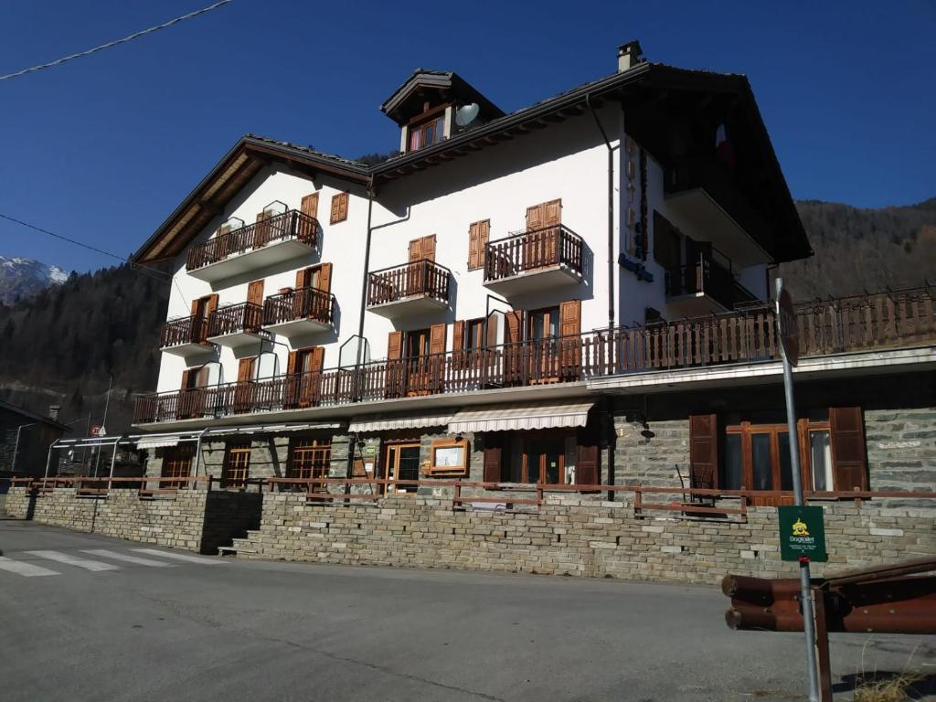 a building with balconies on the side of it at Hotel Beau Sejour in Champorcher