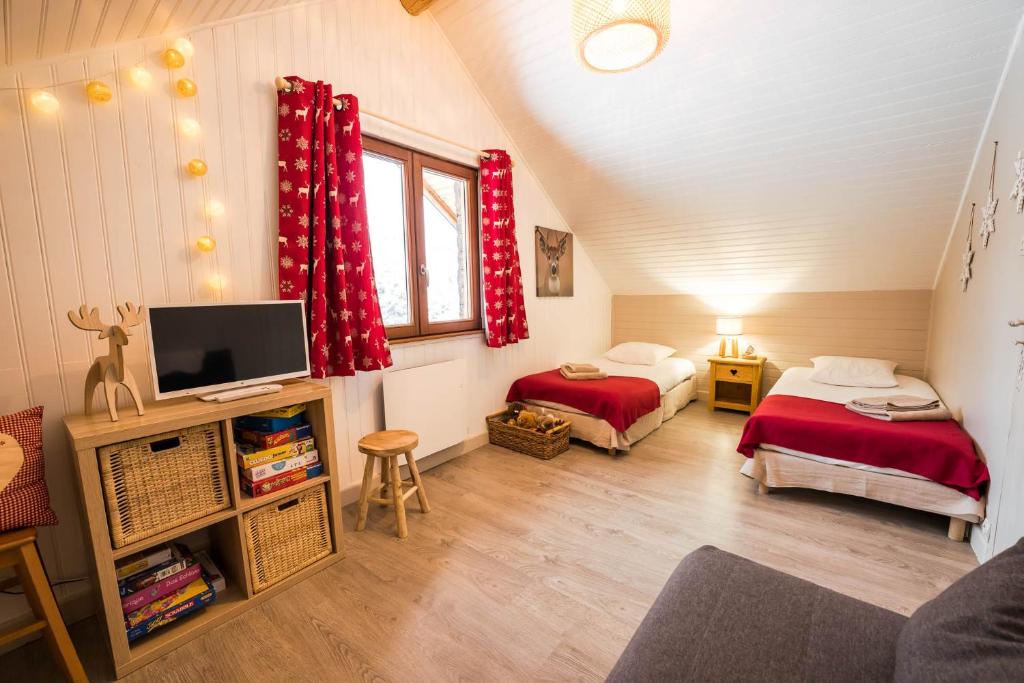 Postel nebo postele na pokoji v ubytování Le Bois des Neiges Charmant chalet authentique à 5 mn de Gérardmer