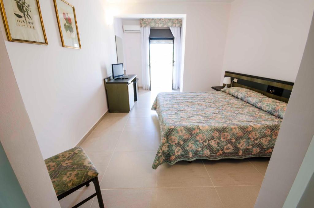 Postel nebo postele na pokoji v ubytování Torre Del Sole