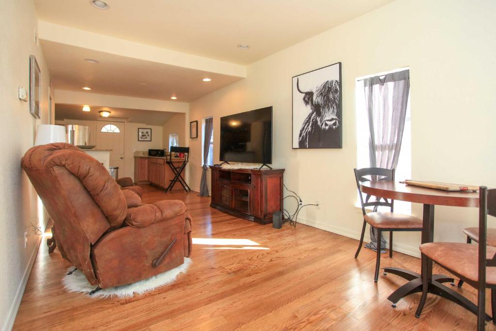 a living room with a chair and a table at Downtown Home with Grill 5 Mi to Garden of the Gods in Colorado Springs