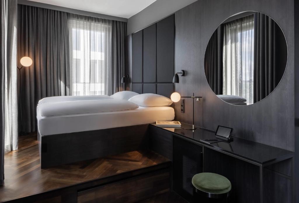 Postel nebo postele na pokoji v ubytování Hotel ROMY by AMANO