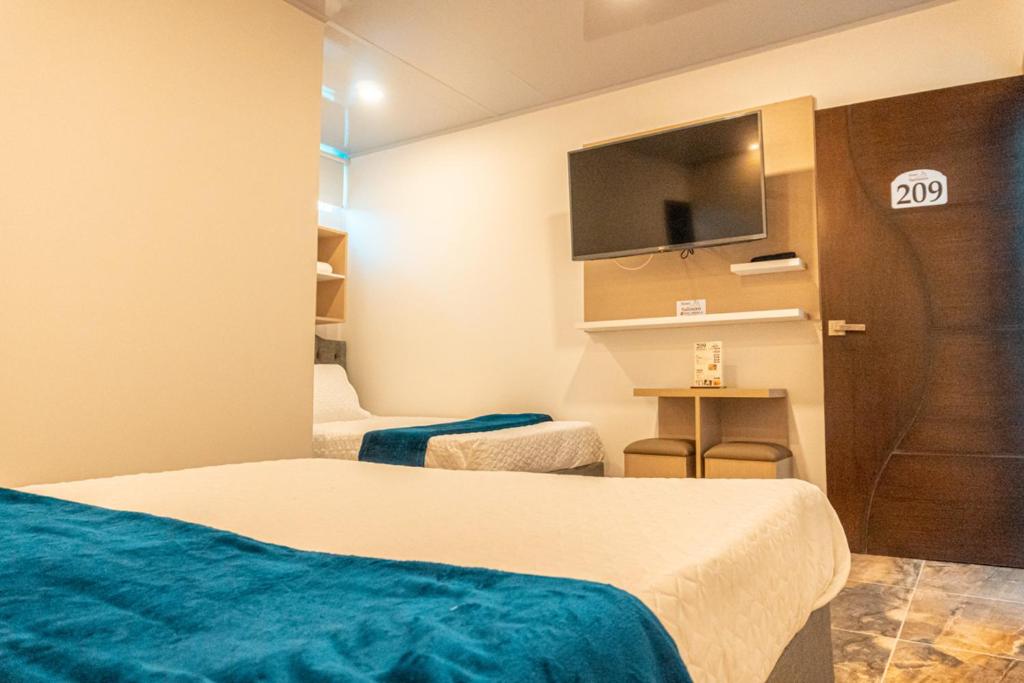 Postel nebo postele na pokoji v ubytování Hotel Salinero - Zipaquirá