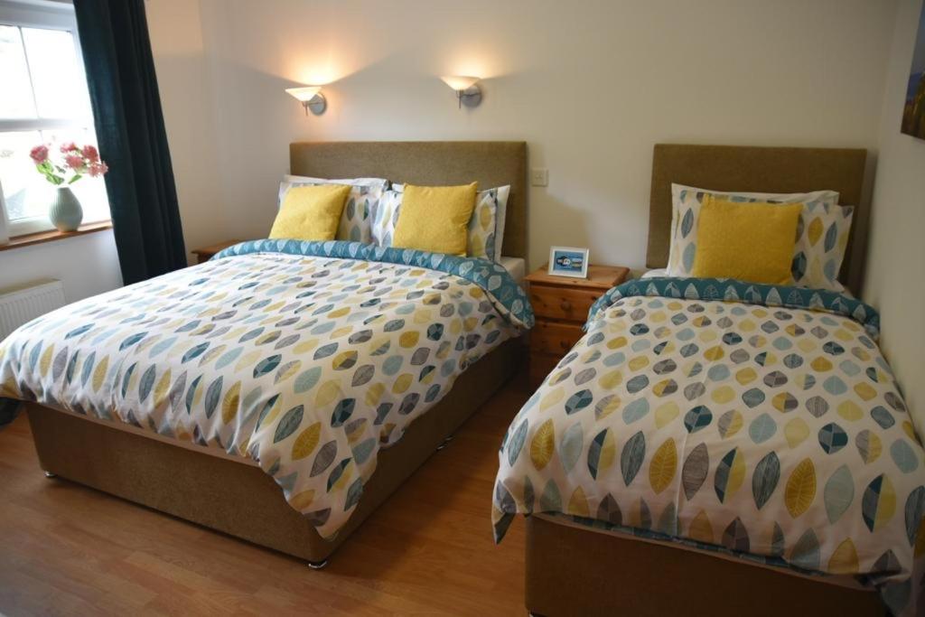Postel nebo postele na pokoji v ubytování Slieve League House B&B