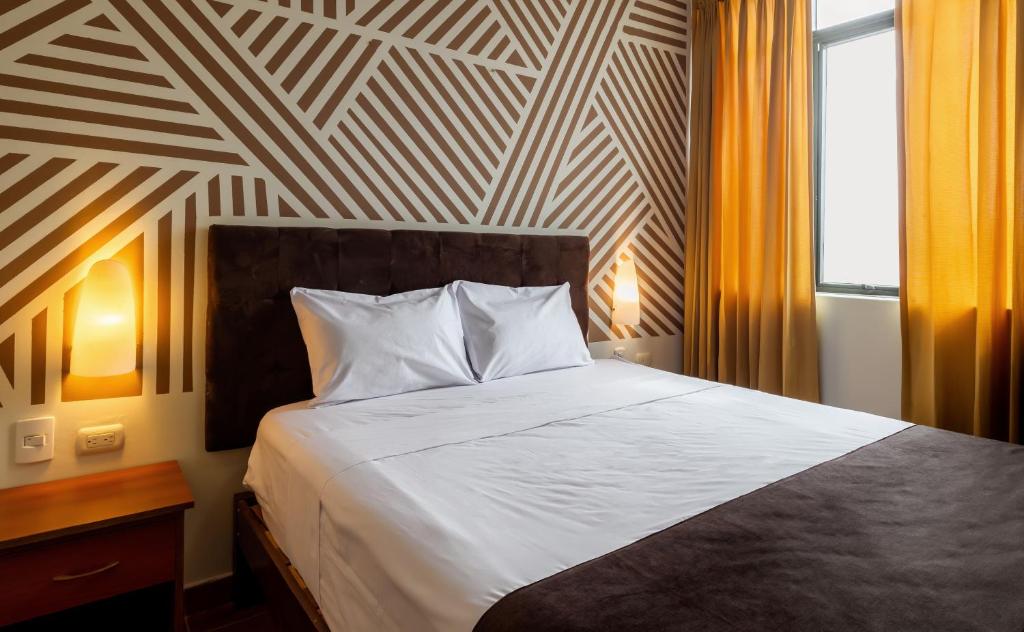 Ένα ή περισσότερα κρεβάτια σε δωμάτιο στο Hotel Rio Blanco