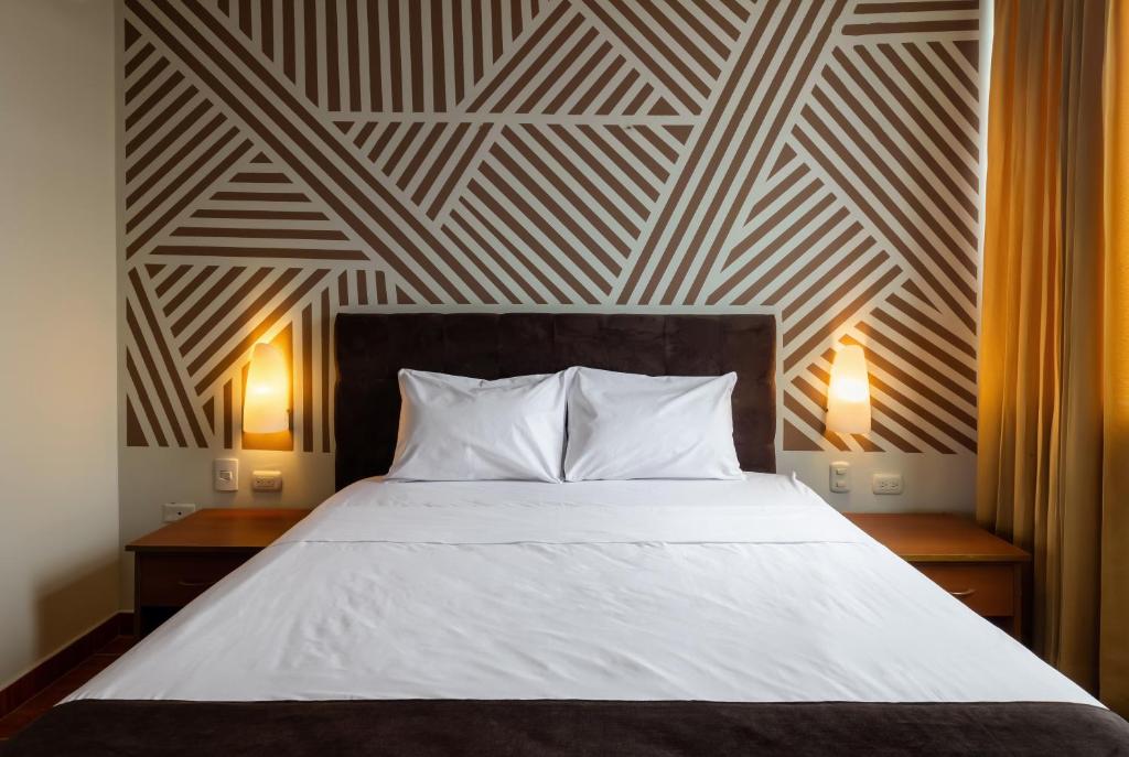 Ένα ή περισσότερα κρεβάτια σε δωμάτιο στο Hotel Rio Blanco