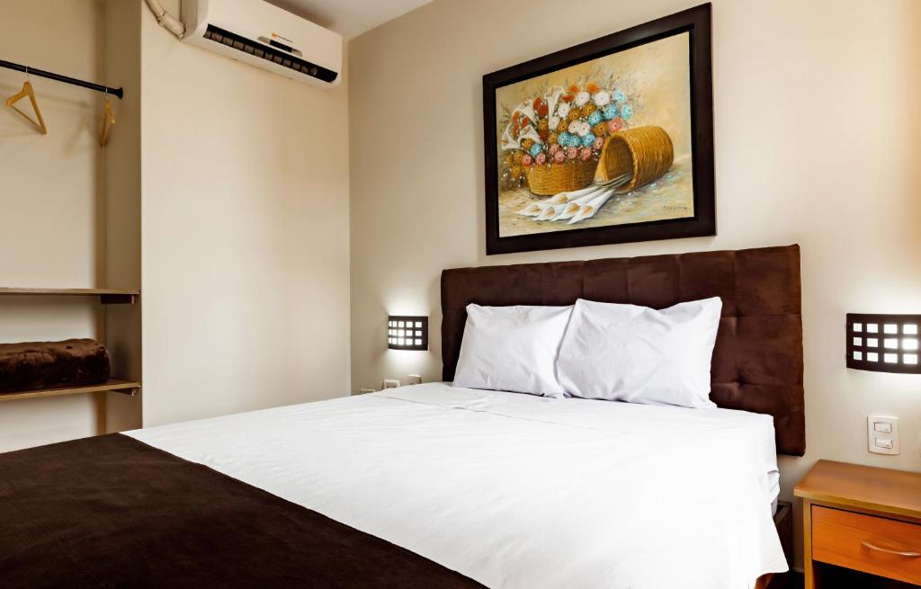 Ένα ή περισσότερα κρεβάτια σε δωμάτιο στο Hotel Rio Blanco