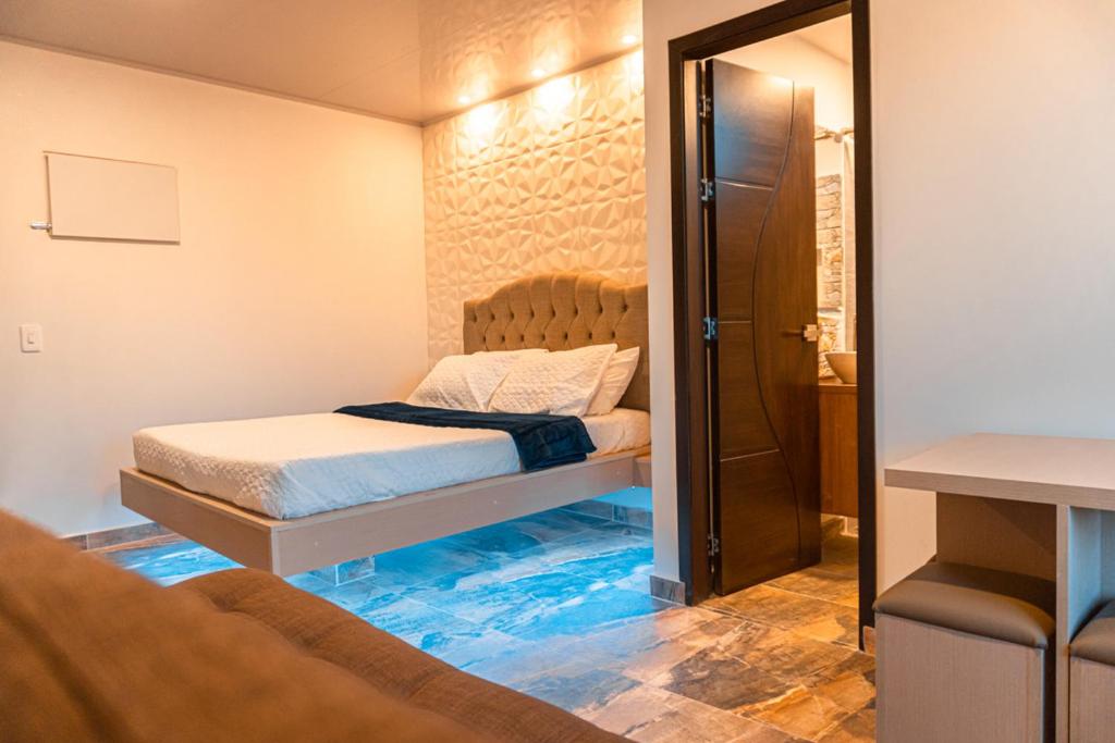 Postel nebo postele na pokoji v ubytování Hotel Salinero - Zipaquirá