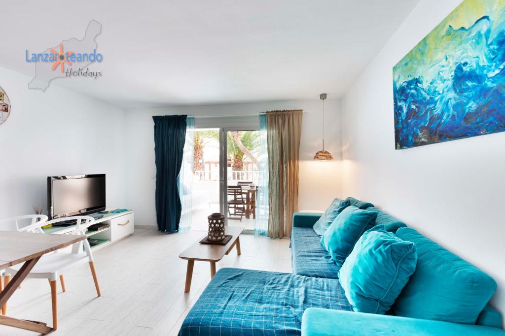 TV a/nebo společenská místnost v ubytování Vivienda Vacacional Sea Garden